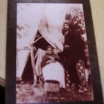A photo of Kisoquah and her son Tony Loon in front of a teepee.